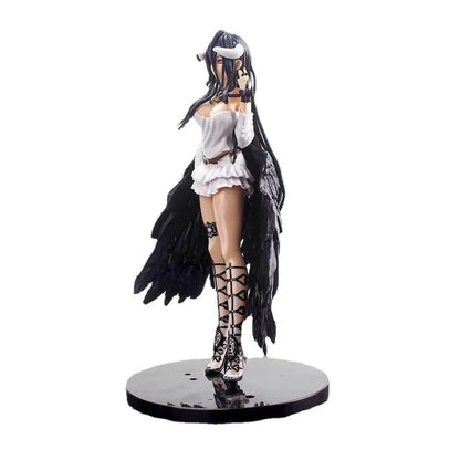 Albedo figure with black hair, horns, white top, black wings, and lace-up boots on a round base.