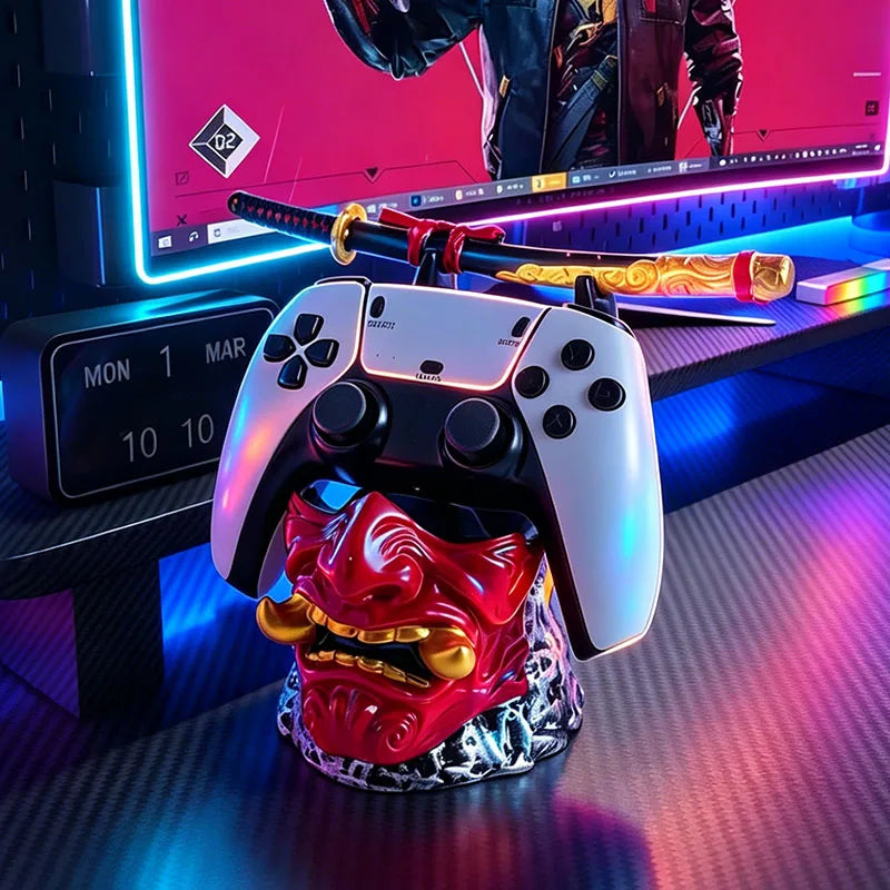 A red and gold Oni mask holder displays a white game controller and a decorative katana sword.