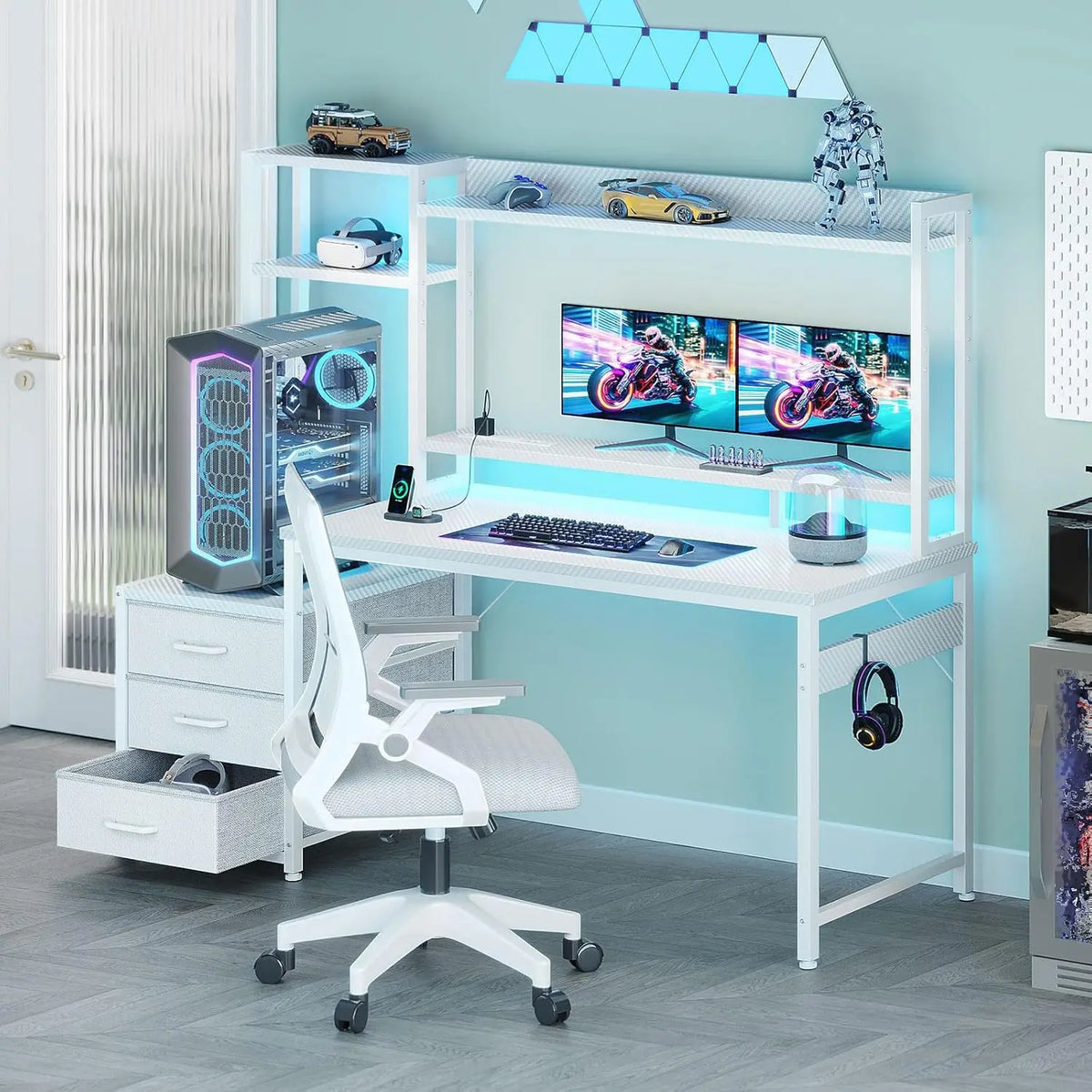 White gaming desk with hutch, monitors, LED lights, PC tower, 3 fabric drawers, and a matching white chair.