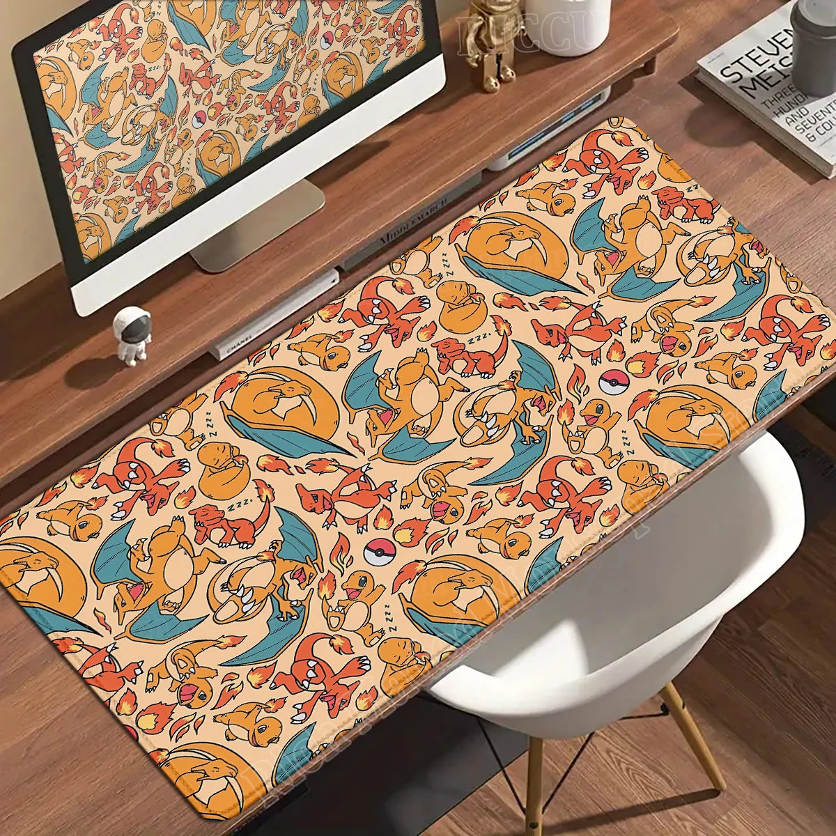 Beige desk mat featuring a repeating pattern of Charizard, Charmander, and Pokéballs in orange, red, and blue.