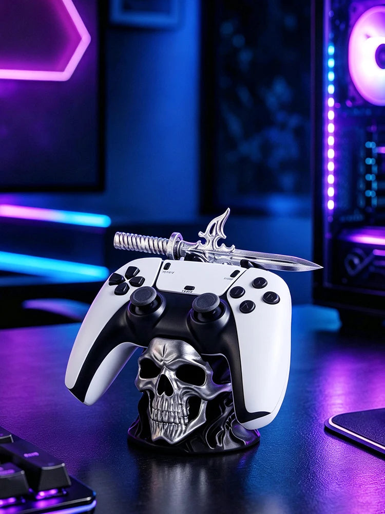 Silver skull game controller stand holding a white and black controller, topped with a silver sword.