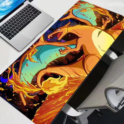 Large desk mat featuring Charizard in orange, yellow, and blue against a dark background, next to a laptop.