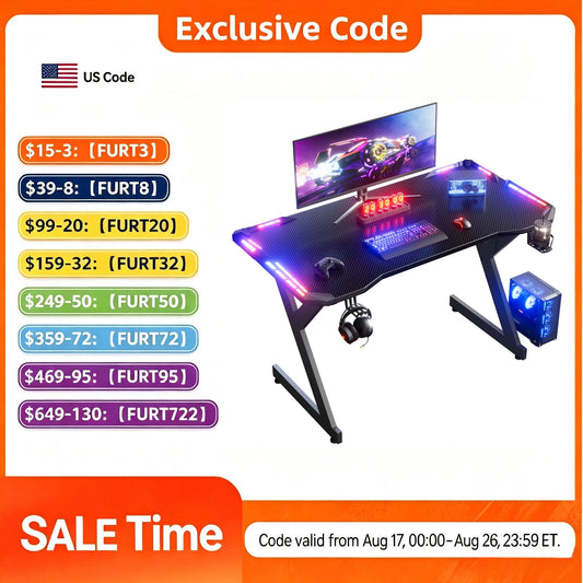 Black Y-shaped gaming desk with glowing RGB LED lights, a carbon-fiber surface, and a computer setup.