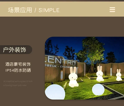 Glowing white Miffy rabbit lamps and round globe lights illuminate a dark outdoor garden at night.