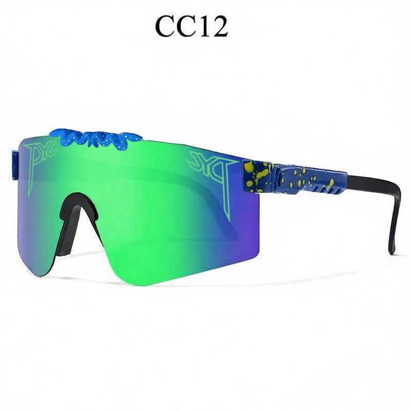 Sport sunglasses with green and purple reflective shield lenses, blue frames, yellow paint splatters, and black temples.