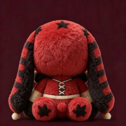 Back of a red and black stuffed rabbit toy, featuring star prints and striped long ears.