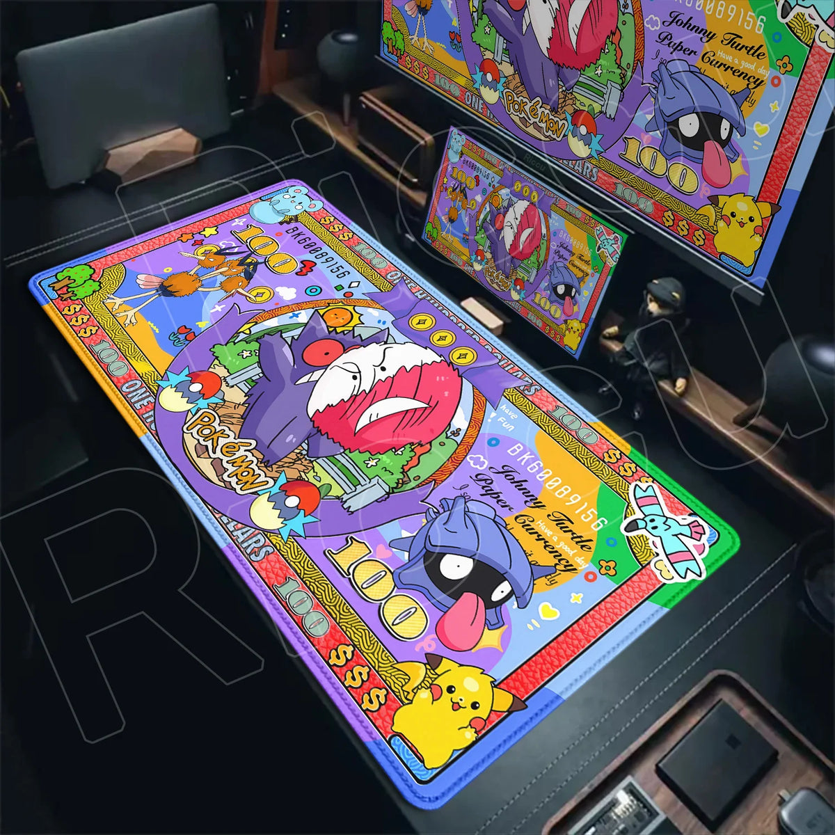 An XXL desk mat styled like colorful Pokémon money with Gengar, Pikachu, and other characters.