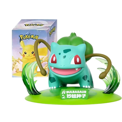Bulbasaur action figure on a green base, with a Pokémon blind box in the background.