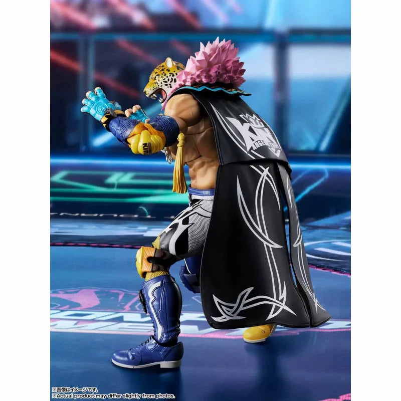 King action figure in a fighting stance wearing a jaguar mask, black cape with white trim, and blue wrestling gear.