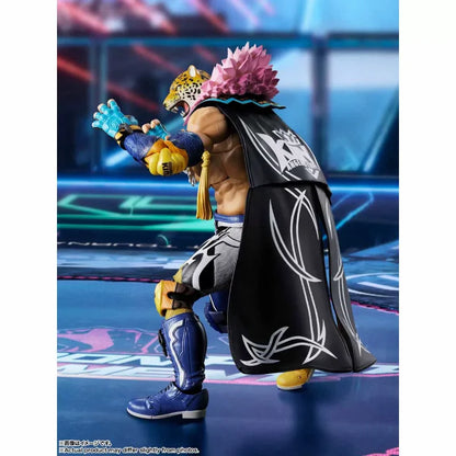 King action figure in a fighting stance wearing a jaguar mask, black cape with white trim, and blue wrestling gear.