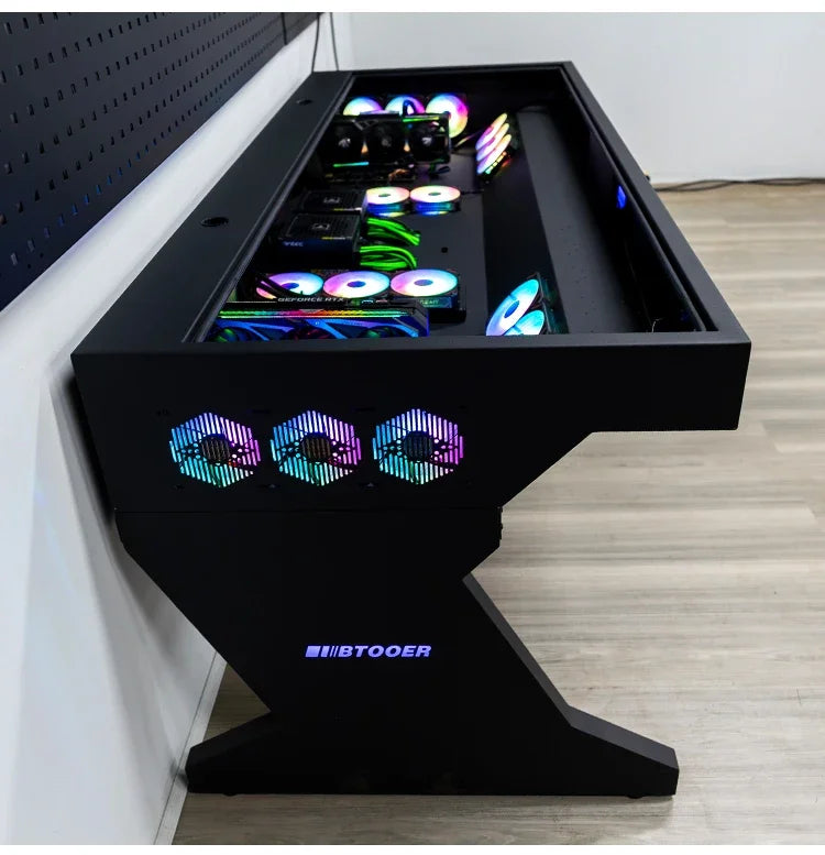 Black computer chassis integrated desk with RGB fans, internal components, and BTOOER logo on the Z-shaped leg.