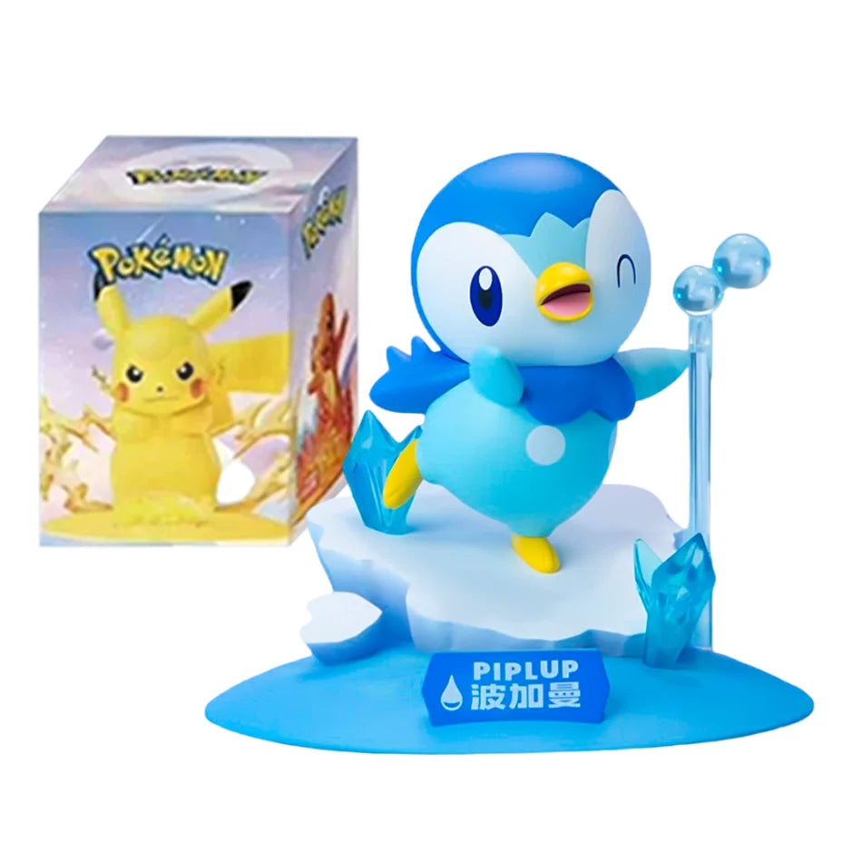 Piplup figurine on an ice base with water crystals, next to a Pikachu box.