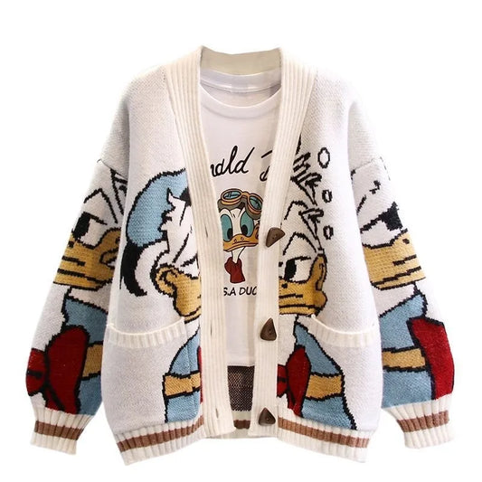 White jacquard knit cardigan featuring Donald Duck cartoon print, V-neck, brown buttons, and striped trim.