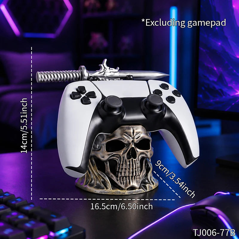 A black and white game controller rests on a metallic skull-shaped holder with a sword resting horizontally across the top.