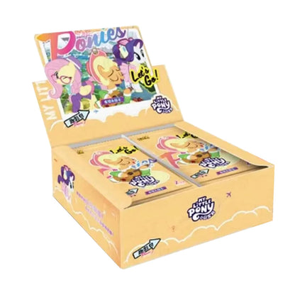 Open yellow My Little Pony trading card booster box displaying character packs inside.