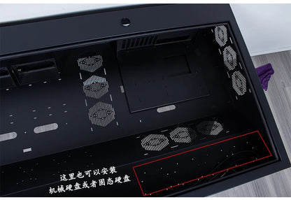 A large black computer chassis desk with multiple fan vents and internal mounting trays.