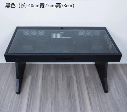 Black desk with an integrated glass-top computer chassis, featuring visible internal cooling fans and components.