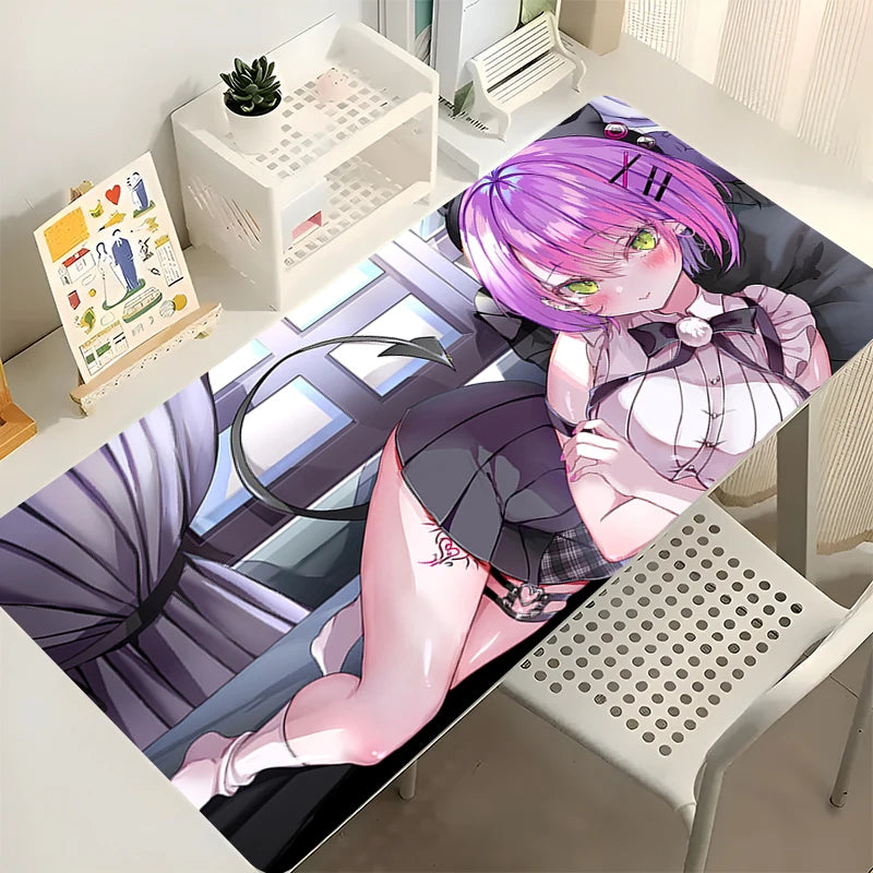 Tokoyami Towa desk mat featuring a pink-haired anime girl with a devil tail and green eyes.
