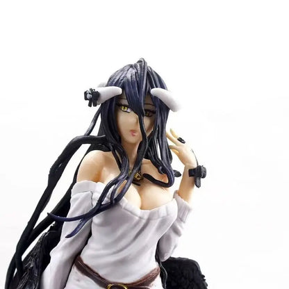 Albedo anime figure with long black hair, white horns, gold eyes, and a white off-shoulder top against a white background.