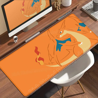 Orange Charizard desk mat on a wooden desk, featuring the Pokémon with blue wings and a fiery tail.