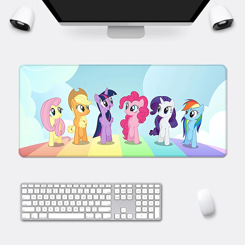 My Little Pony desk mat features Fluttershy, Applejack, Twilight Sparkle, Pinkie Pie, Rarity, and Rainbow Dash on a rainbow.