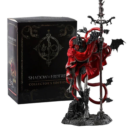 Messmer figurine in red robes and dark armor holding a tall staff, beside a black collector's edition box.