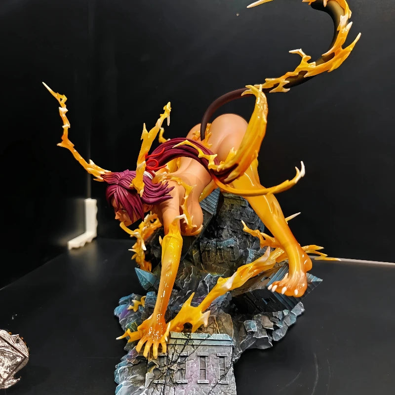 Yoruichi Shihouin anime figure in a cat-like stance on a rocky base, surrounded by yellow energy effects.