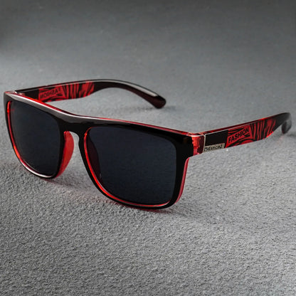 Black and translucent red square sunglasses with dark lenses and "FASHION" printed on the temples.