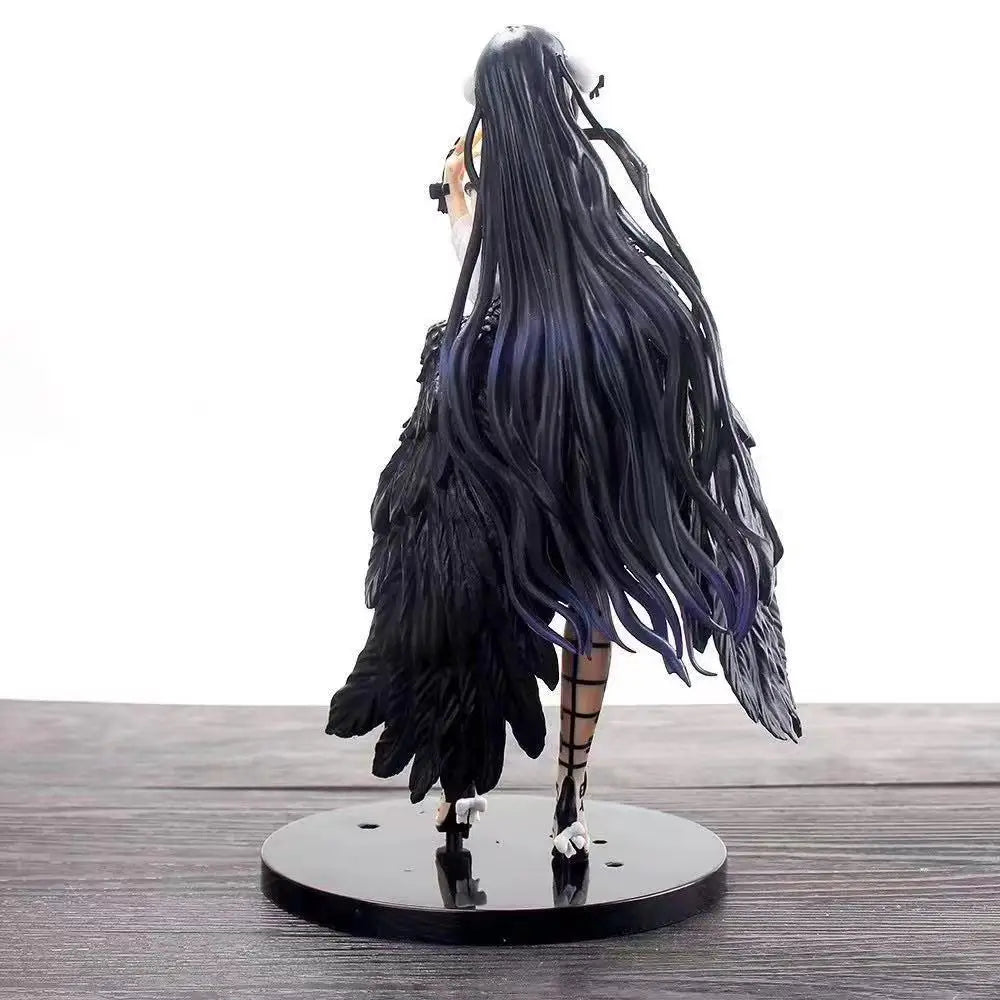 Back view of Albedo figure with long black hair, large black wings, and strapped legs on a black stand.