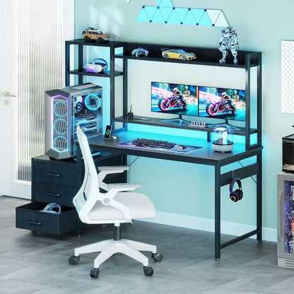 Black gaming desk with hutch, 3 drawers, LED lights, dual monitors, PC tower, and white office chair.