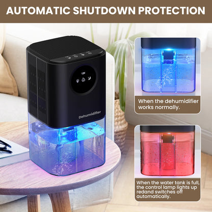 Black portable dehumidifier with blue glowing water tank on wooden table.