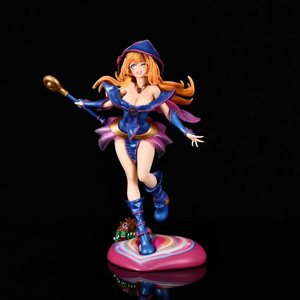 Anime figurine of Dark Magician Girl in blue and pink outfit holding a staff, standing on a colorful base.