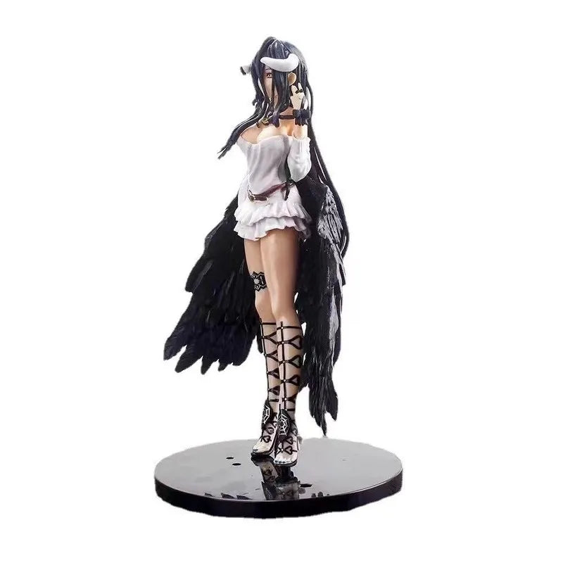 Albedo anime figure in white dress, black feathered wings, horns, and laced sandals standing on a black base.