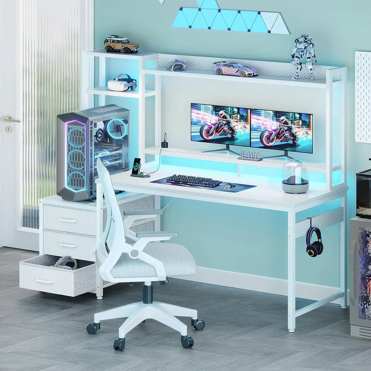 A white gaming desk featuring a hutch, three fabric drawers, LED backlights, and dual monitors, paired with a white chair.