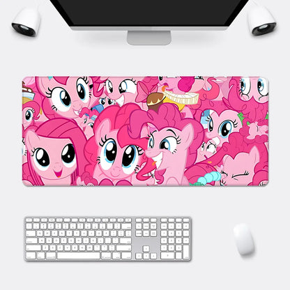 An XXL desk mousepad featuring a collage of pink My Little Pony characters with large blue eyes.