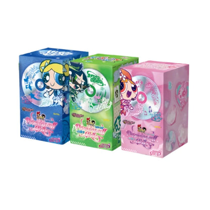 Three colorful Powerpuff Girls collectible card boxes in blue, green, and pink, featuring character illustrations and CDs.