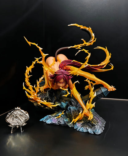 Yoruichi Shihouin anime figure with purple hair, cat tail, and orange lightning effects on a rocky base.