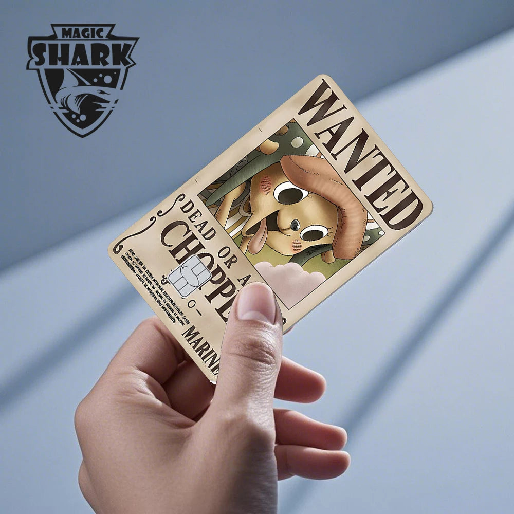 Tan anime card sticker with "WANTED" and "DEAD OR ALIVE CHOPPER" text, held in a hand.