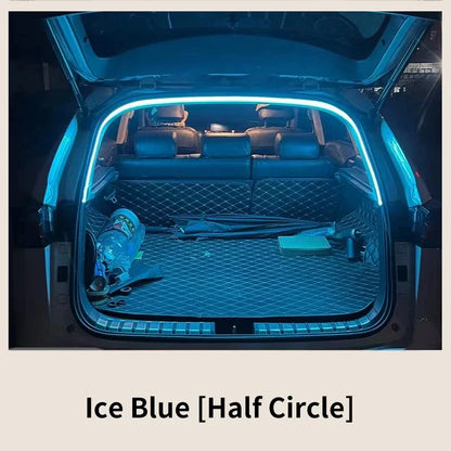 An open car trunk illuminated by an ice-blue LED light strip outlining the frame.