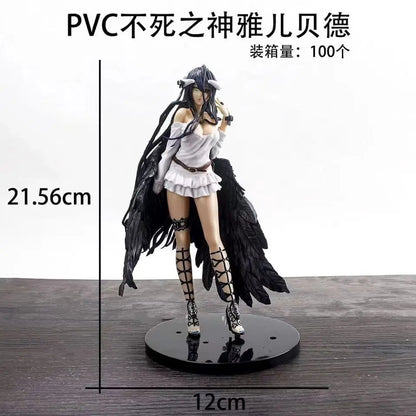 An Albedo anime figure in a white dress with black wings and strappy boots on a round black base.
