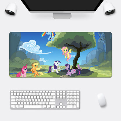 Large My Little Pony desk mat featuring colorful cartoon ponies in a green landscape with a tree and blue sky.