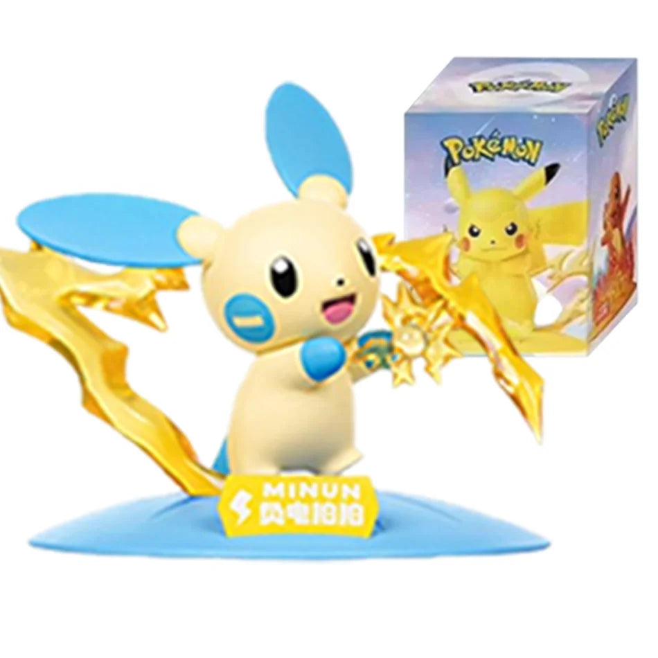 Minun action figure in blue and cream, standing on a blue base with a Pokemon box in the background.