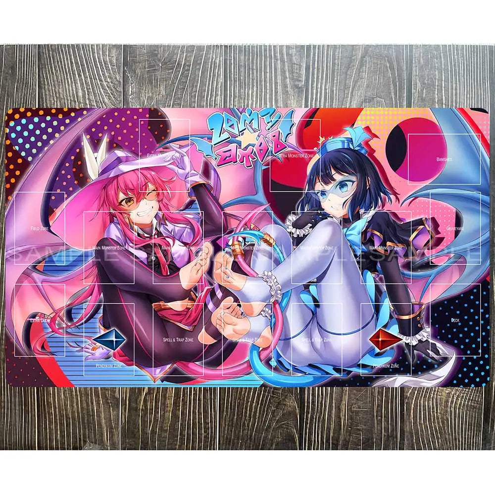 Yu-Gi-Oh playmat with two anime girls in pink and blue outfits amid game zones, colorful background, and "SAMPLE" watermark.