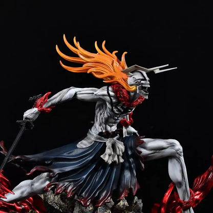 Ichigo figurine with grey skin, long orange hair, white horned mask, dark skirt, and sword in a dynamic pose.