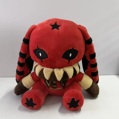 Red and black plush rabbit with star prints, striped long ears, and a ruffled collar.