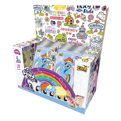 An open My Little Pony trading card box filled with foil packs featuring Rainbow Dash, with colorful Ponyville graphics.