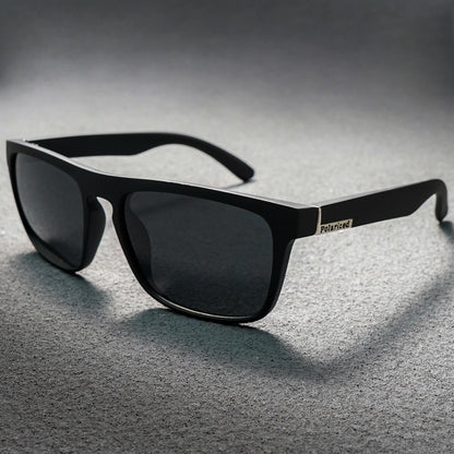 Matte black square sunglasses with dark lenses and a silver "Polarized" emblem on the temple.