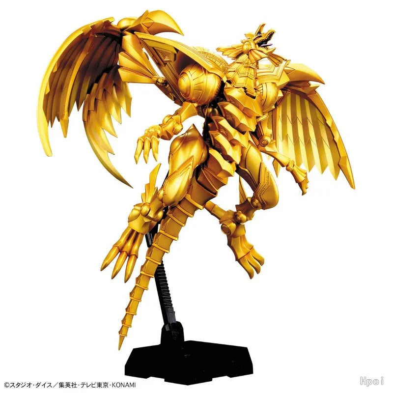 Gold-colored mechanical dragon model toy with large wings and armored body, posed mid-air on a black stand.