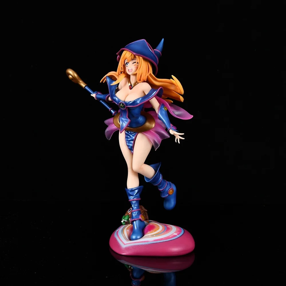 Dark Magician Girl anime figure in blue and pink outfit, holding a staff, on a heart-shaped base.