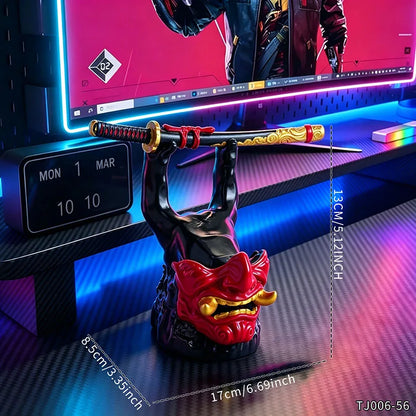 A black and red oni mask controller and sword holder stands on a desk.
